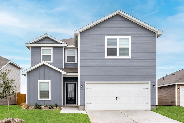 view of front of house with a front lawn and a garage