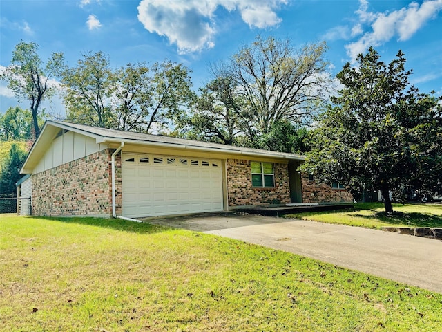 single story home with a front yard and a garage