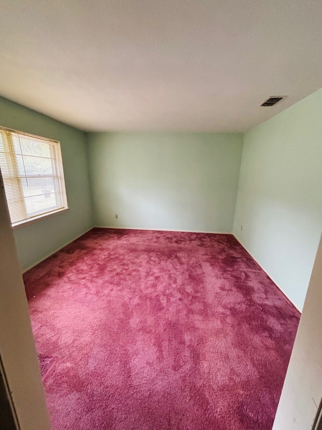 spare room featuring carpet