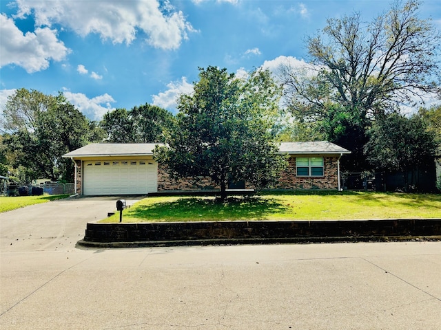 ranch-style home with a front yard and a garage