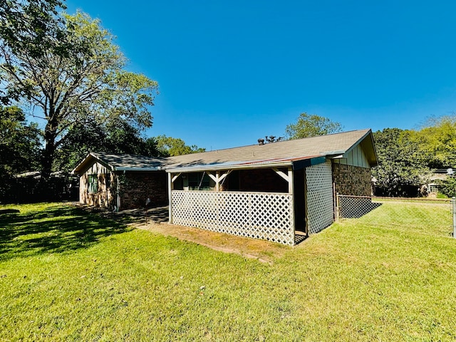 view of outbuilding with a lawn