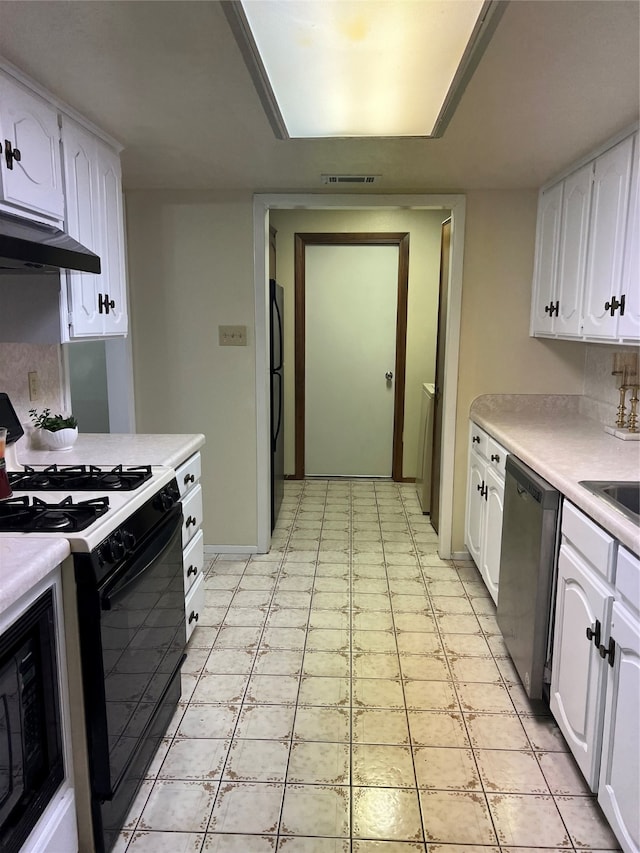 kitchen with black appliances, ventilation hood, and white cabinets