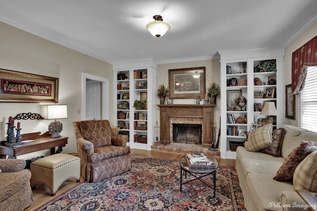 living room featuring ornamental molding, wood-type flooring, and a fireplace