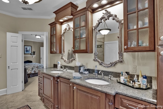 bathroom featuring vanity and ornamental molding