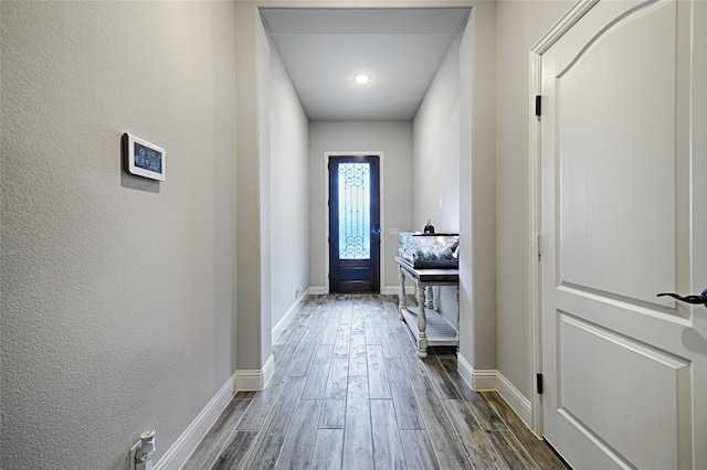 doorway featuring dark wood-type flooring