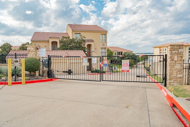 view of gate with fence