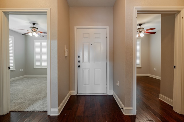 entrance foyer with ceiling fan and dark hardwood / wood-style flooring