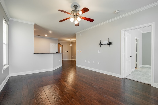 unfurnished living room featuring dark wood-type flooring, ceiling fan, and crown molding