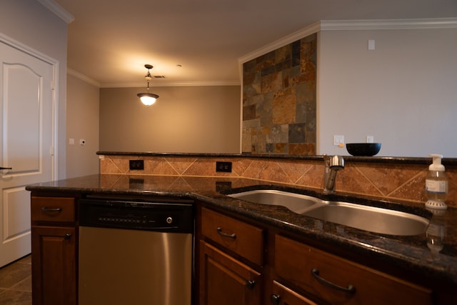 kitchen with dishwasher, dark stone countertops, ornamental molding, sink, and pendant lighting