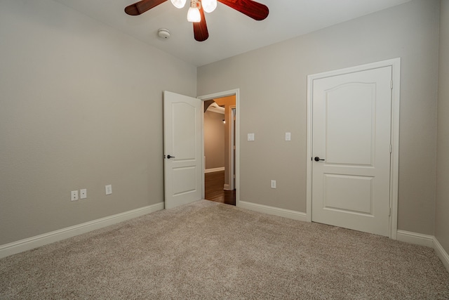 unfurnished bedroom with carpet flooring and ceiling fan