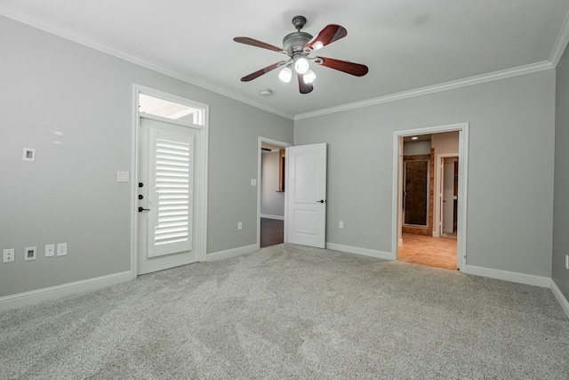 unfurnished bedroom with ornamental molding, ensuite bathroom, light colored carpet, and ceiling fan