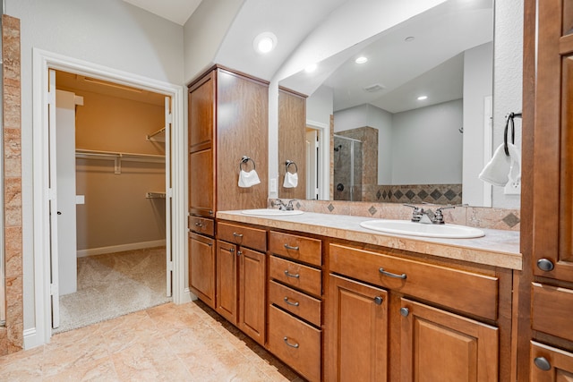 bathroom featuring vanity, tile patterned floors, and walk in shower