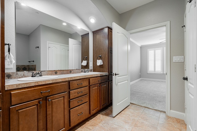 2120 Portofino Dr, Rockwall, TX 75032 - bathroom featuring baseboards, double vanity, tile patterned floors, crown molding, and recessed lighting