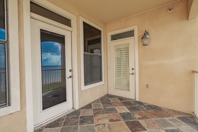 doorway to property featuring a patio area