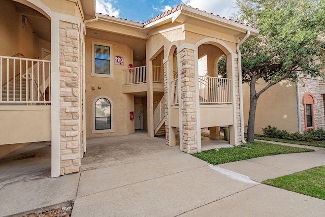 2120 Portofino Dr, Rockwall, TX 75032 - view of front facade featuring stairs, stucco siding, and a tiled roof