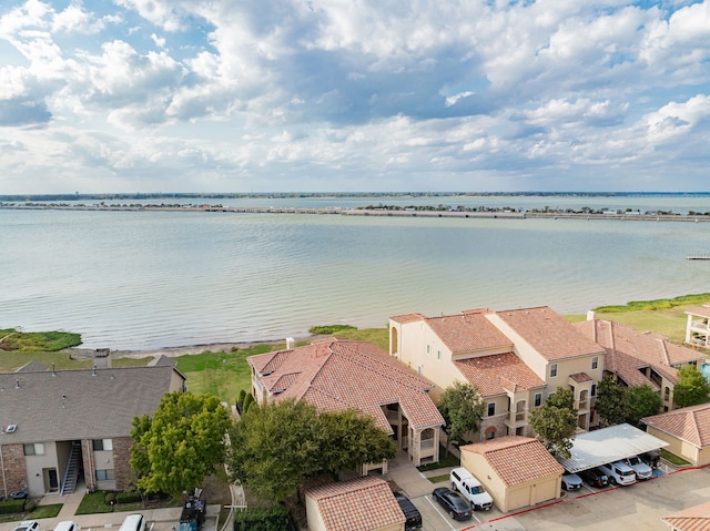birds eye view of property featuring a residential view and a water view