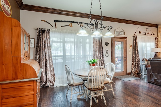 dining area featuring crown molding and dark hardwood / wood-style floors