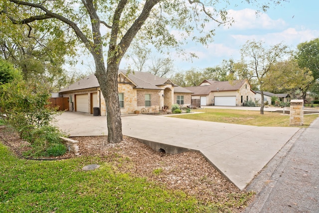 single story home featuring a garage and a front lawn