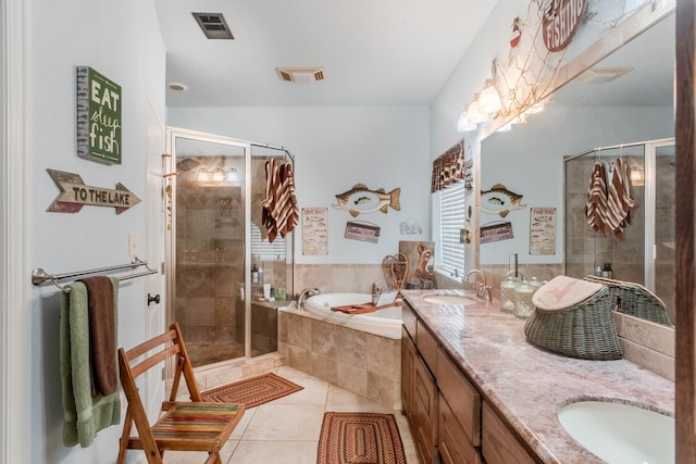 bathroom featuring vanity, separate shower and tub, and tile patterned flooring