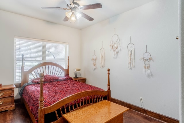 bedroom with dark wood-type flooring and ceiling fan