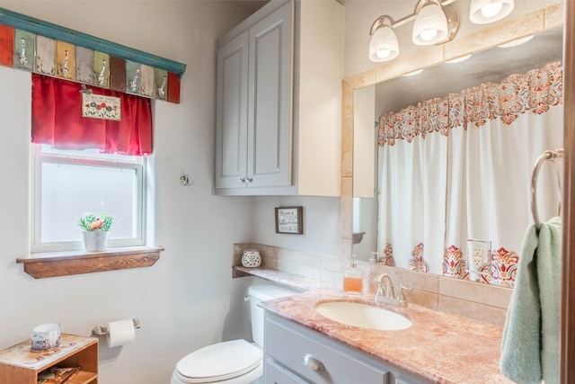 bathroom with vanity and toilet