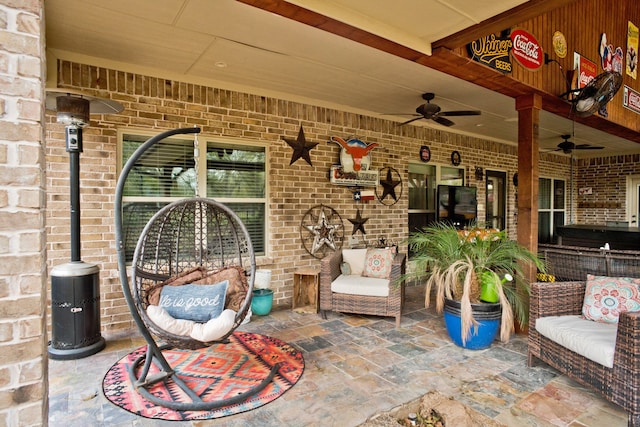 view of patio / terrace featuring ceiling fan