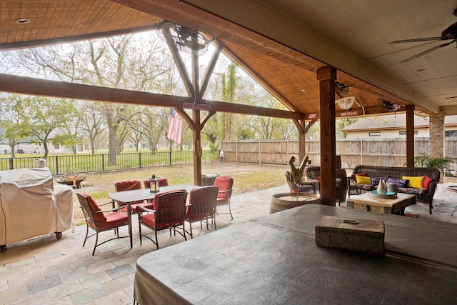 view of patio featuring a gazebo, a grill, and ceiling fan