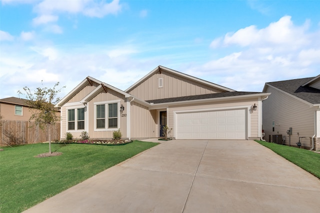 view of front of property with a garage and a front lawn