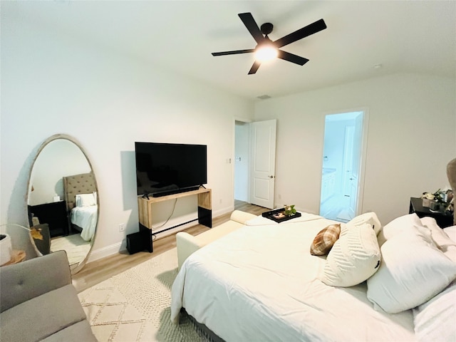 bedroom with light hardwood / wood-style floors and ceiling fan