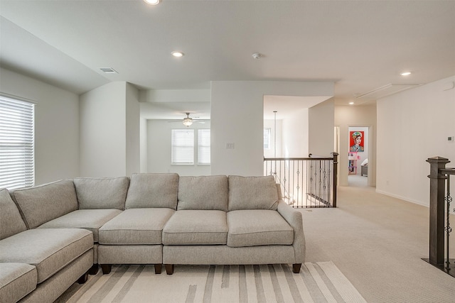 living room with light carpet and ceiling fan