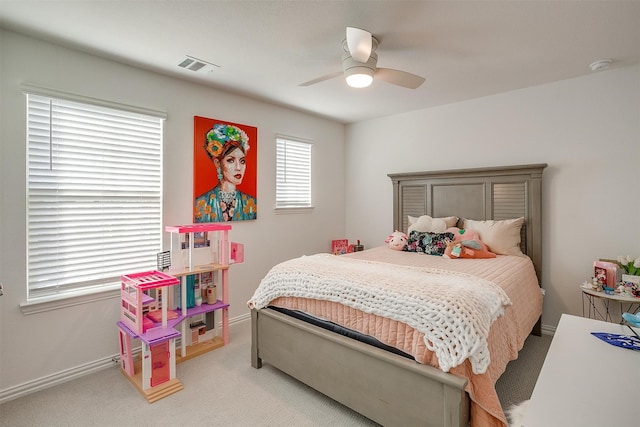 bedroom with light colored carpet and ceiling fan