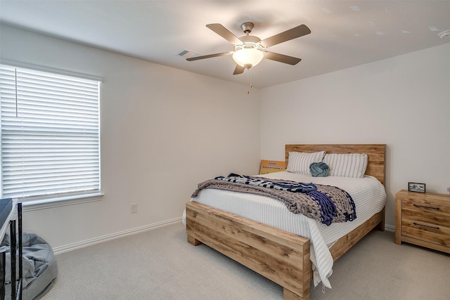 bedroom featuring light carpet and ceiling fan