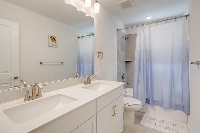 full bathroom with vanity, toilet, shower / bathtub combination with curtain, and tile patterned flooring