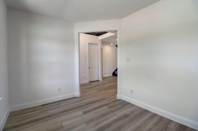 empty room with light hardwood / wood-style floors