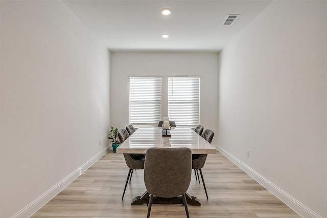 dining area with light hardwood / wood-style floors