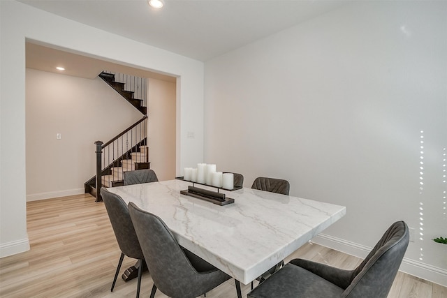 dining area featuring light wood-type flooring