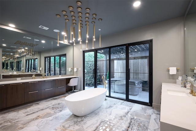 bathroom with vanity and a bathtub