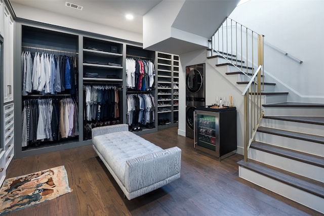 spacious closet with dark hardwood / wood-style flooring