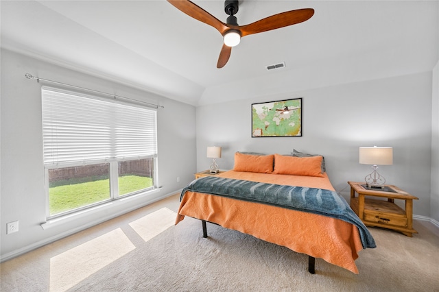 carpeted bedroom featuring ceiling fan and vaulted ceiling