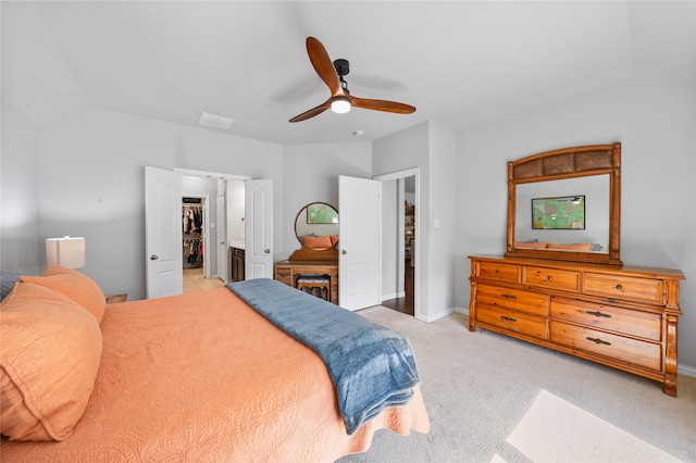 bedroom with ceiling fan and light carpet