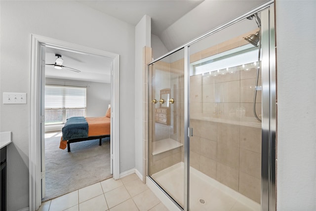 bathroom featuring tile patterned floors, ceiling fan, vanity, and an enclosed shower