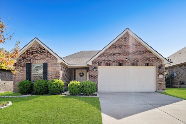 view of front of house featuring a front yard and a garage