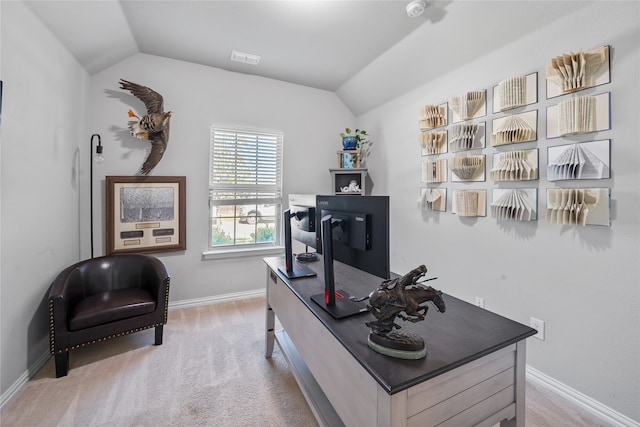 carpeted home office with lofted ceiling