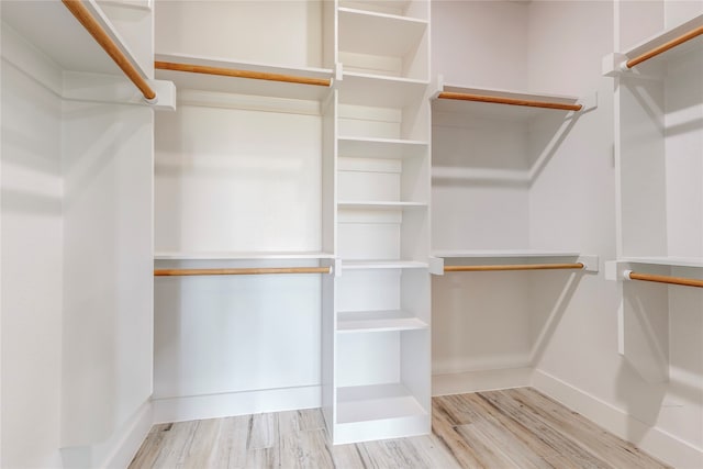 spacious closet with wood finished floors