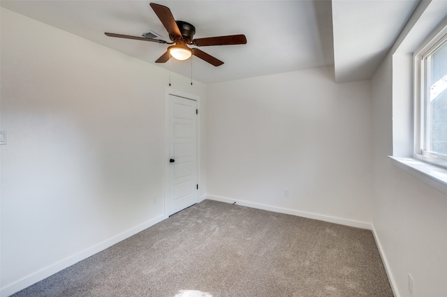 carpeted empty room with ceiling fan