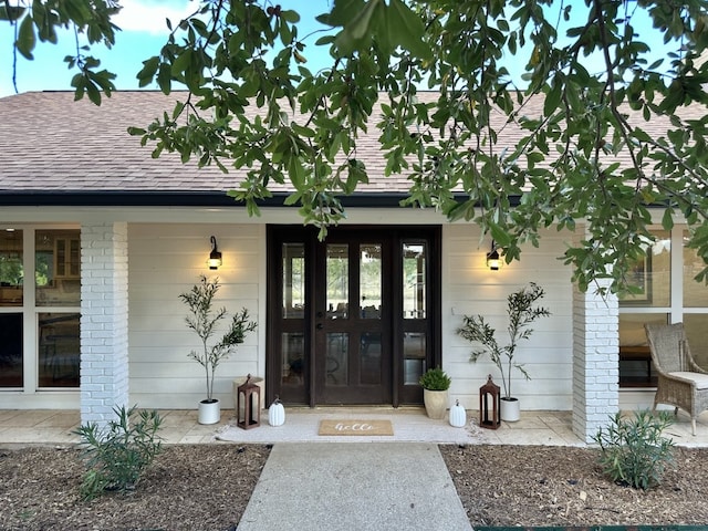 property entrance featuring french doors