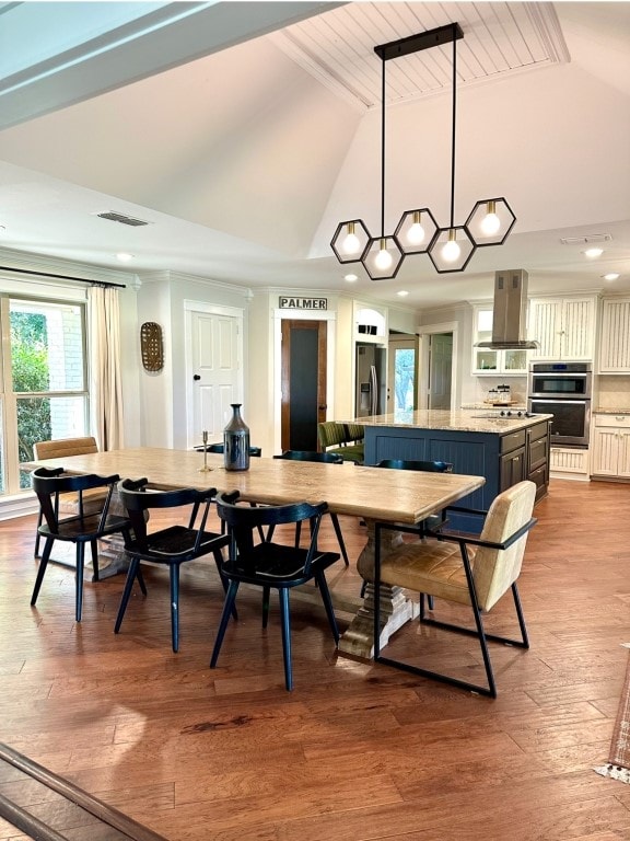 dining space featuring wood ceiling, high vaulted ceiling, and light hardwood / wood-style flooring