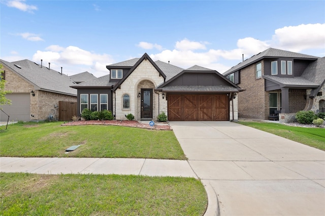 view of front of house featuring a garage and a front lawn