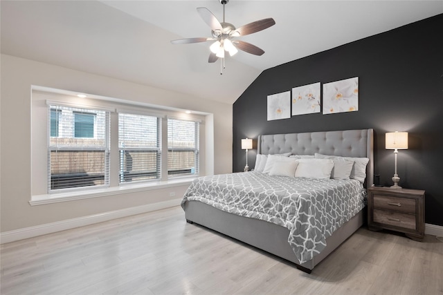 bedroom with lofted ceiling, wood-type flooring, and ceiling fan