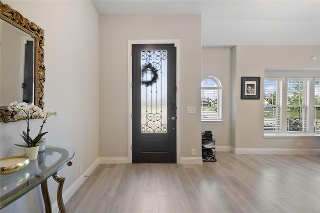 entryway with light hardwood / wood-style flooring